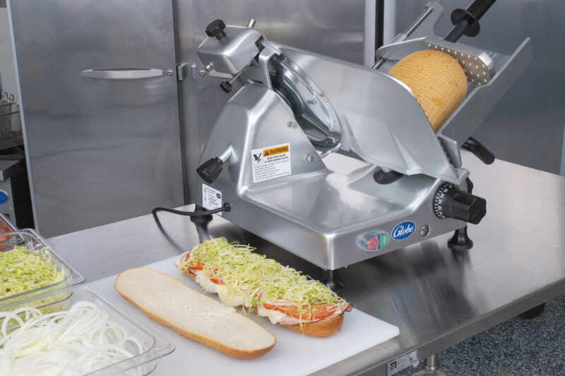 Globe G12 manual slicer with sandwich open on table