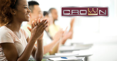 smiling student with Crown logo