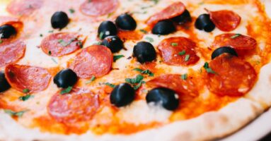 Close-up of pepperoni and olive pizza