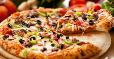 Pizza with peperoni and olives