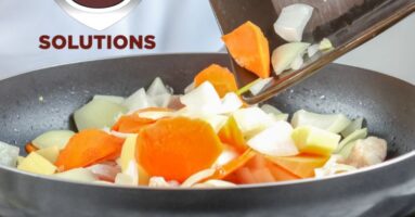 Chef cooking vegetables in pan - Wells Ventless Universal