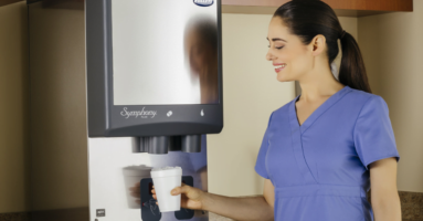 Healthcare worker dispensing ice from Follett hospital ice machine