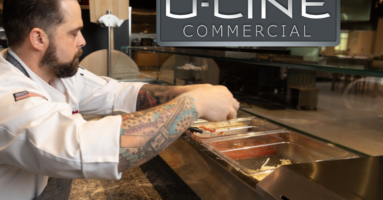 Using the commercial pizza prep table from U-Line