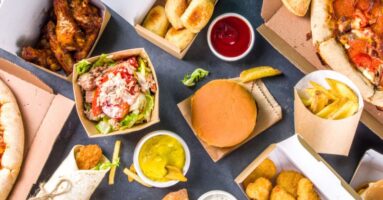 Variety of take out food in brown containers