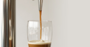 nitro stout beer being poured under a tap
