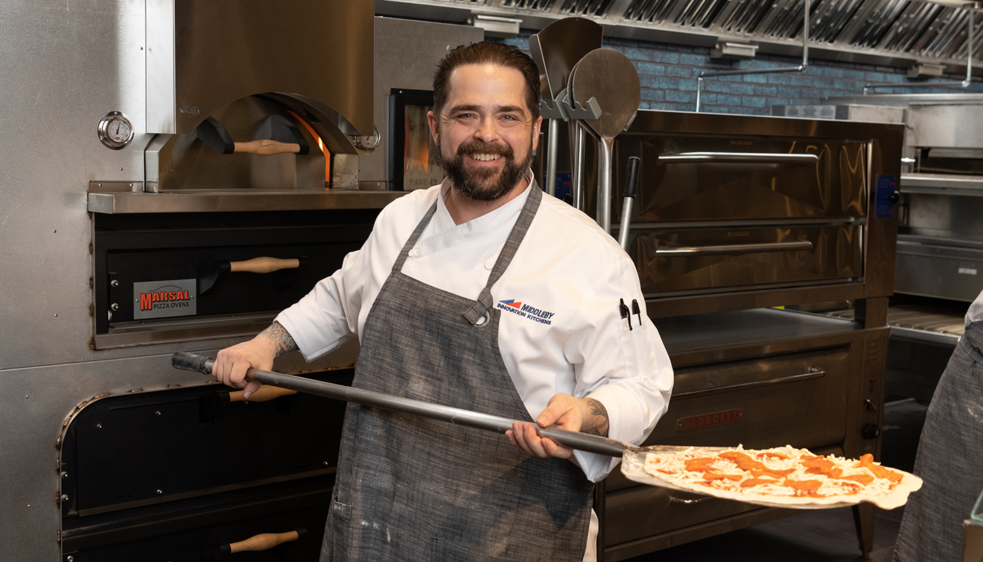 Chef Mike Elling cooking pizza in a Marsal oven