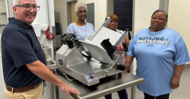 school nutrition professionals and a globe slicer