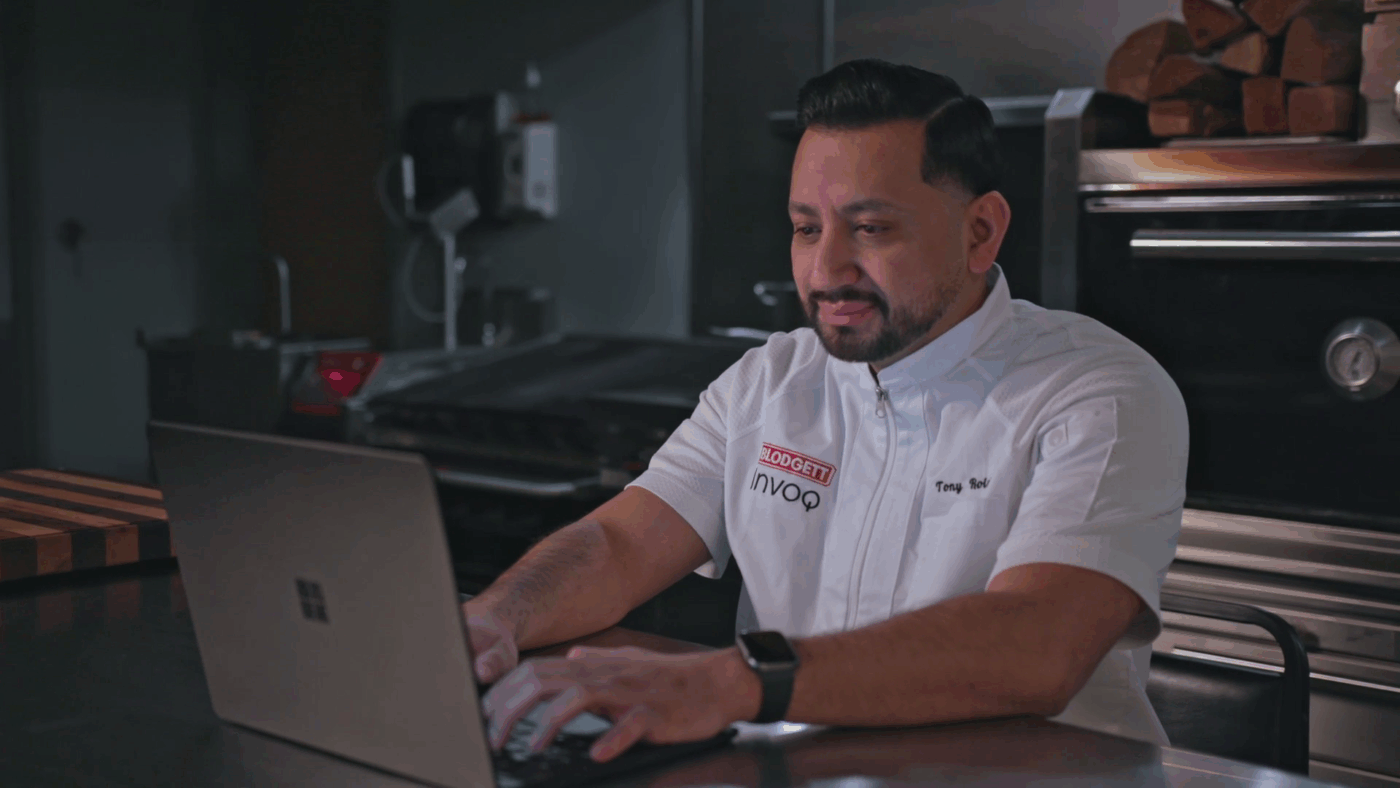 A chef working on a computer