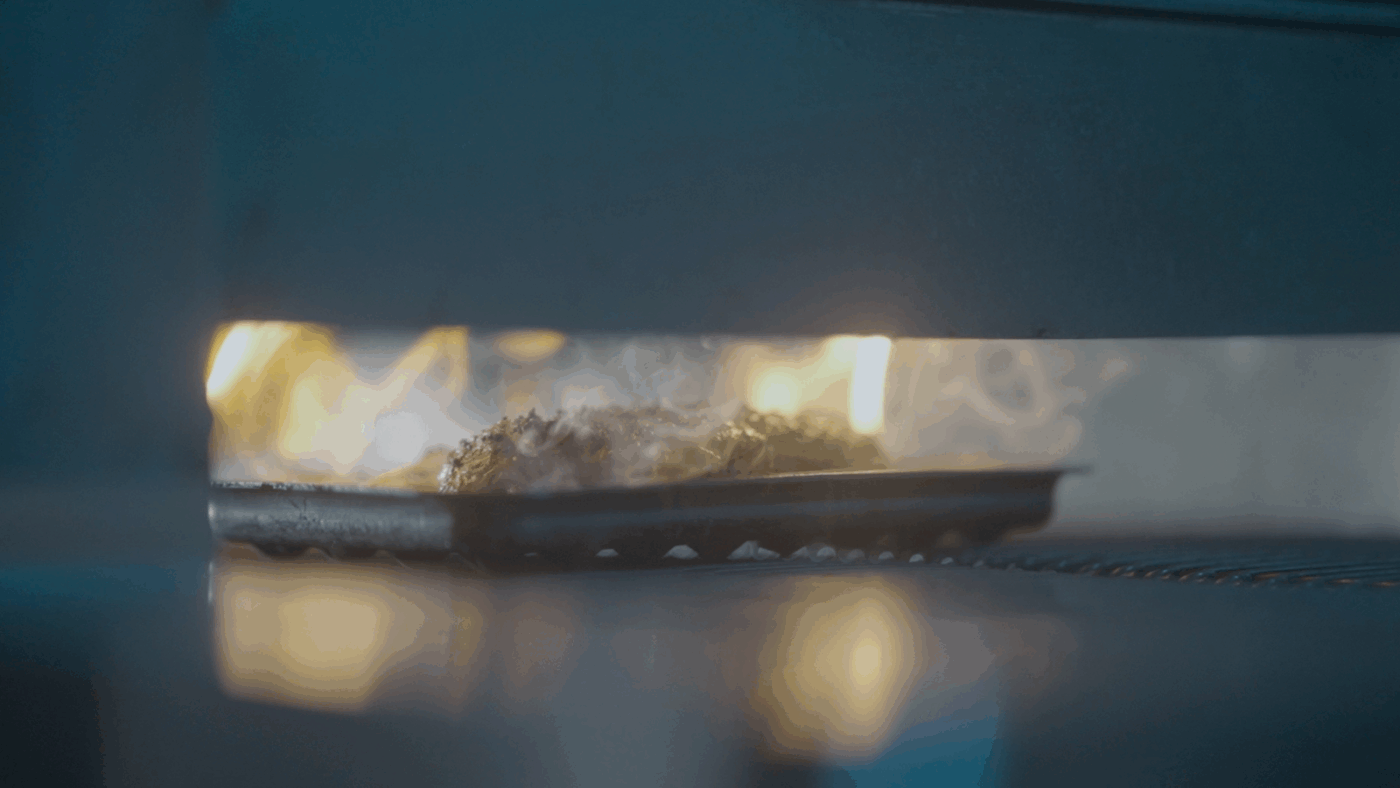 looking inside an oven to see flames